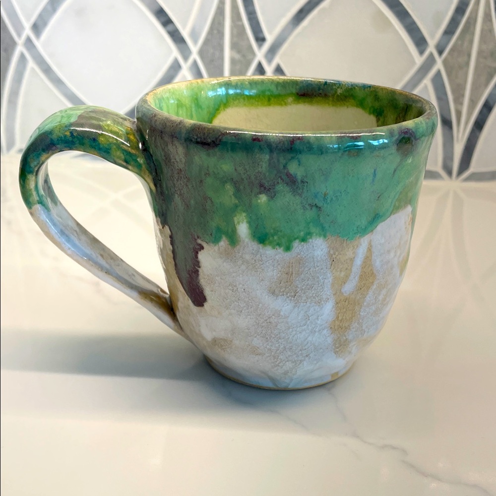 Handmade pottery mug with handle